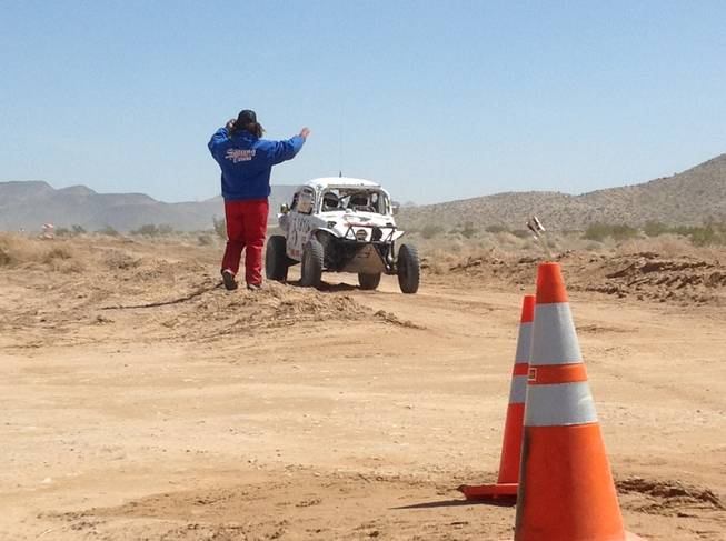 Competitors in the Mint 400 get a wave. The race was held on Saturday, March 23, 2013, near Las Vegas.