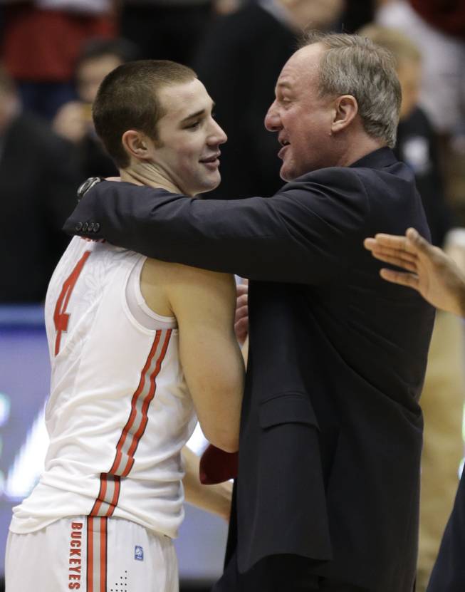 Ohio State head coach Thad Matta, right, hugs guard Aaron Craft (4) after they defeated Iowa State 78-75 in a third-round game of the NCAA college basketball tournament on Sunday, March 24, 2013, in Dayton, Ohio. Craft hit the game-winning three-point basket.