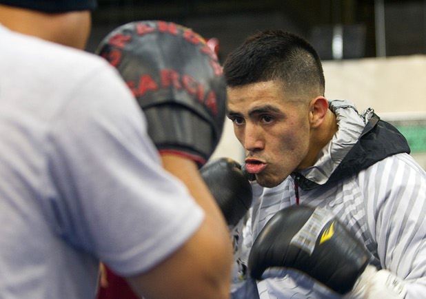 Light welterweight boxer Brandon Rios works on his timing with trainer Robert Garcia at Top Rank Gym Wednesday, March 27, 2013. Rios will face Mike Alvarado for a rematch at the Mandalay Bay Saturday.