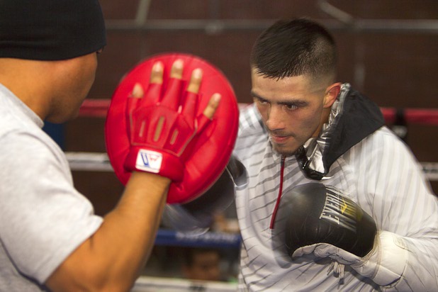 Light welterweight boxer Brandon Rios works on his timing with trainer Robert Garcia at Top Rank Gym Wednesday, March 27, 2013. Rios will face Mike Alvarado for a rematch at the Mandalay Bay Saturday.
