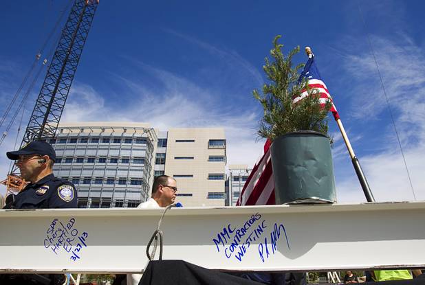 A traditional evergreen tree sits on the final beam during a topping-out ceremony for the Federal Justice Tower in downtown Las Vegas Wednesday, March 27, 2013. The new 11-story tower, just to the south of the Lloyd D. George Federal Courthouse on Las Vegas Boulevard, will house the executive and administrative offices of the Department of Homeland Security, U.S. Immigration, U.S. Attorney's Office for the District of Nevada, the Department of Labor Office of Inspector General and the Federal Protective Services.