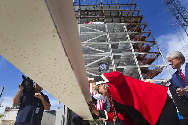 Las Vegas Carolyn Goodman signs the final beam during a topping-out ceremony for the Federal Justice Tower in downtown Las Vegas Wednesday, March 27, 2013. The new 11-story tower, just to the south of the Lloyd D. George Federal Courthouse on Las Vegas Boulevard, will house the executive and administrative offices of the Department of Homeland Security, U.S. Immigration, U.S. Attorney's Office for the District of Nevada, the Department of Labor Office of Inspector General and the Federal Protective Services.
