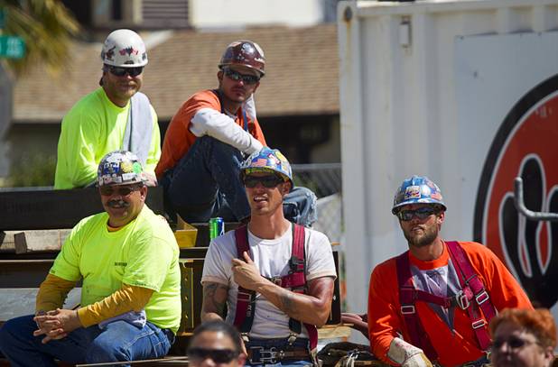 Ironworkers listen to speakers during a topping-out ceremony for the Federal Justice Tower in downtown Las Vegas Wednesday, March 27, 2013. The new 11-story tower, just to the south of the Lloyd D. George Federal Courthouse on Las Vegas Boulevard, will house the executive and administrative offices of the Department of Homeland Security, U.S. Immigration, U.S. Attorney's Office for the District of Nevada, the Department of Labor Office of Inspector General and the Federal Protective Services.