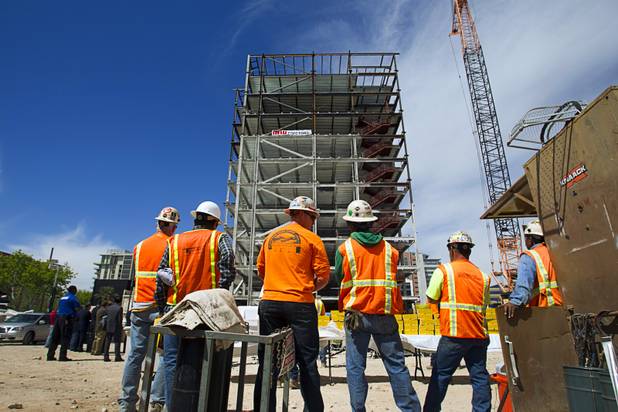 Ironworkers listen to speakers during a topping-out ceremony for the Federal Justice Tower in downtown Las Vegas Wednesday, March 27, 2013. The new 11-story tower, just to the south of the Lloyd D. George Federal Courthouse on Las Vegas Boulevard, will house the executive and administrative offices of the Department of Homeland Security, U.S. Immigration, U.S. Attorney's Office for the District of Nevada, the Department of Labor Office of Inspector General and the Federal Protective Services.