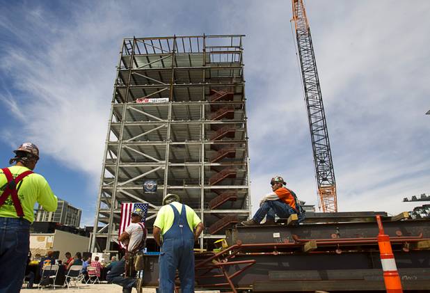 Ironworkers take a break before a topping-out ceremony for the Federal Justice Tower in downtown Las Vegas Wednesday, March 27, 2013. The new 11-story tower, just to the south of the Lloyd D. George Federal Courthouse on Las Vegas Boulevard, will house the executive and administrative offices of the Department of Homeland Security, U.S. Immigration, U.S. Attorney's Office for the District of Nevada, the Department of Labor Office of Inspector General and the Federal Protective Services.