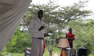Harry Maina, manager of Porini Mara Camp in Ol Kinyei Conservancy in southeastern Kenya, gives guests a tutorial about the region.