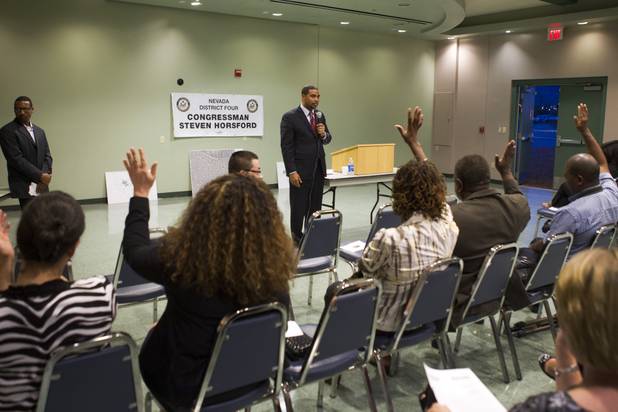 Congressman Steven Horsford (D-NV) asks for a show of hands during a town hall meeting at the Cora Coleman Senior Center in Las Vegas Thursday, March 28, 2013. Horsford was asking who wanted him to fight to keep social security benefits as they are (as opposed to reducing spending on entitlements). Horsford will have a meet and greet at 7222 W. Grand Teton Ave. on Saturday.