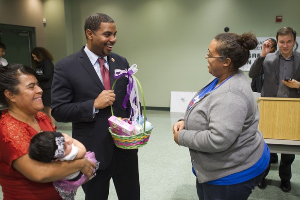 Congressman Steven Horsford (D-NV) receives a Easter basket from Laura Martin during a town hall meeting at the Cora Coleman Senior Center in Las Vegas Thursday, March 28, 2013. Horsford will have a meet and greet at 7222 W. Grand Teton Ave. on Saturday.
