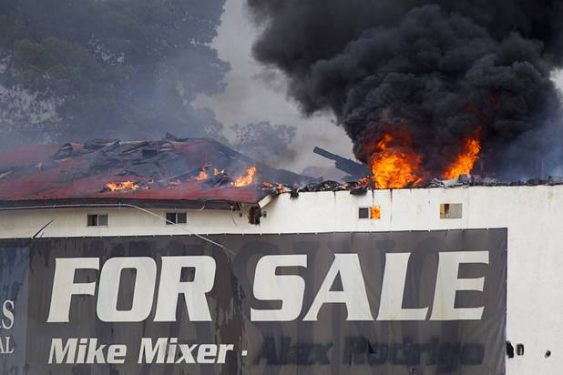 Flames shoot from the roof of the old Key Largo Casino on Flamingo Avenue and Paradise Road Thursday, March 28, 2013.