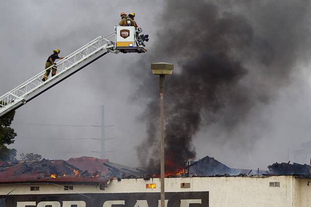 Clark County and City of Las Vegas firefighters battle a four-alarm fire at the old Key Largo Casino on Flamingo Avenue and Paradise Road Thursday, March 28, 2013.