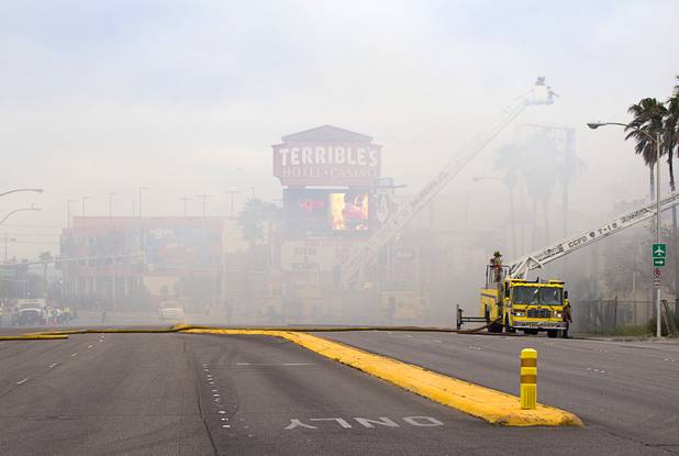 Flamingo Road is obscured by smoke as Clark County and City of Las Vegas firefighters battle a four-alarm fire at the old Key Largo Casino on Flamingo Avenue and Paradise Road Thursday, March 28, 2013.