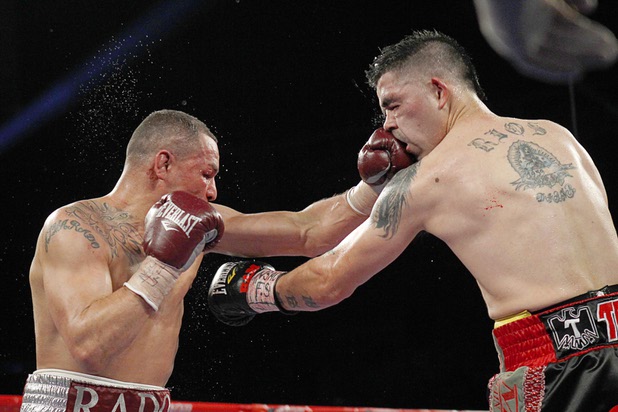 Mike Alvarado, left, connects with a punch on Brandon Rios during a super lightweight bout for an interim 140lb. WBO title at the Mandalay Bay Events Center Saturday, March 30, 2013. The fight was a rematch to a Oct. 13, 2012 fight  which Rios won.
