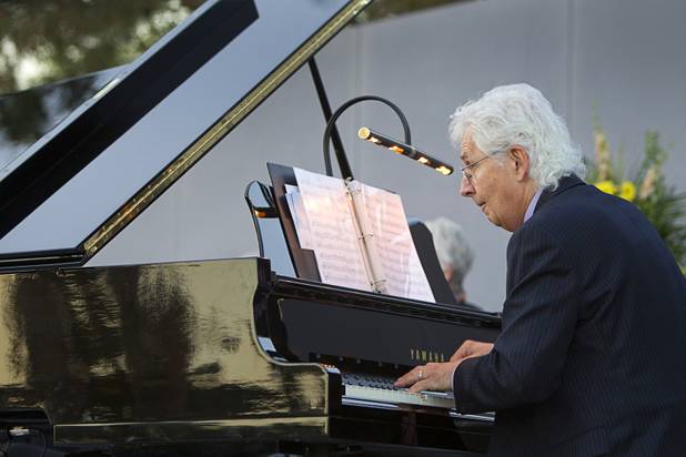 Larry Walker plays an Easter overture at the start of the 28th annual Easter sunrise service at Palm Eastern Mortuary and Cemetery Sunday, March 31, 2013.