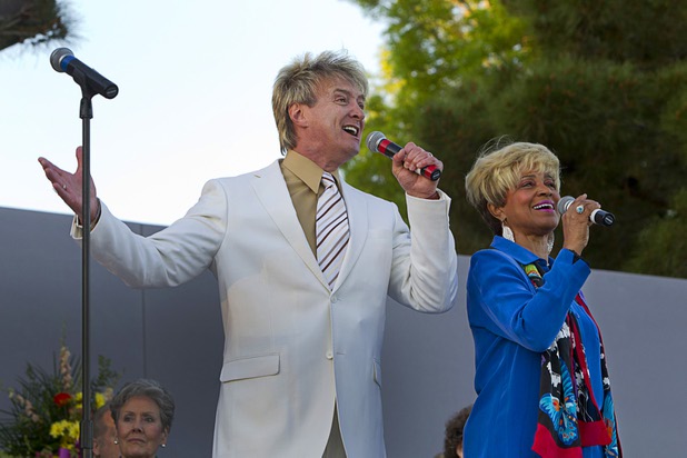 Pastor Bill Walker and Genevieve Dew sing "The Lord's Prayer" during the 28th annual Easter sunrise service at Palm Eastern Mortuary and Cemetery Sunday, March 31, 2013.