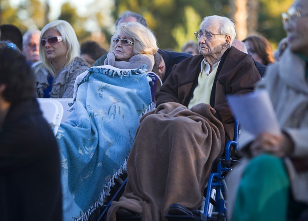People use blankets to keep warm during the 28th annual Easter sunrise service at Palm Eastern Mortuary and Cemetery Sunday, March 31, 2013.