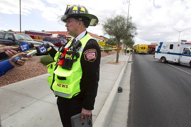 Las Vegas Fire and Rescue spokesman Tim Szymanski briefs reporters after an accident at the Egg and I restaurant on West Sahara Avenue Monday April 1, 2013. As many as 10 people were injured when a Lexus sedan left the roadway and crashed into the restaurant.