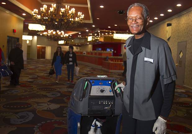 Henry Moore, a carpet shampoo porter, known for whistling and singing as he works during the graveyard shift, poses at the Excalibur Monday, April 1, 2013. Hes been entertaining guests in the dead of night for almost a quarter century.