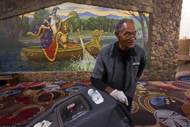 Henry Moore, a carpet shampoo porter, known for whistling and singing as he works, pauses during his graveyard shift at the Excalibur Monday, April 1, 2013. Hes been entertaining guests in the dead of night for almost a quarter century.