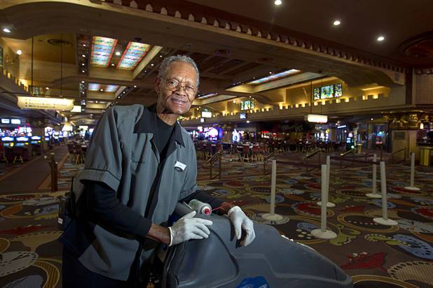 Henry Moore, a carpet shampoo porter, known for whistling and singing as he works during the graveyard shift, poses at the Excalibur Monday, April 1, 2013. Hes been entertaining guests in the dead of night for almost a quarter century.