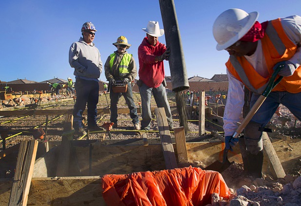 A crew pours a slab for a new home at the Mountain's Edge master planned community in the southwest west part of the Las Vegas Valley April 1, 2013. A supervisor at the pour said he had recently added 15 new workers to keep up with demand.