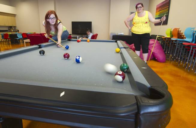 Gaylyn Daniels, left, and Alicia Wade play billiards in the youth room at the Gay and Lesbian Community Center of Southern Nevada, 401 S. Maryland Pkwy, Monday, April 1, 2013. There will be a grand opening for the center on Saturday, April 6, form 10 a.m. to 4 p.m. 