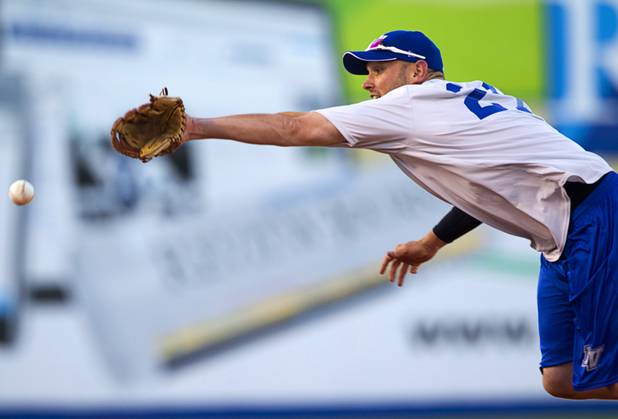 Outfielder Andrew Brown stretches for a ball during Las Vegas 51s practice at Cashman Field on Tuesday, April 2, 2013. The 51s open the season Thursday against the RiverCats at Sacramento. This is the first year the 51s are affiliated with the Mets.