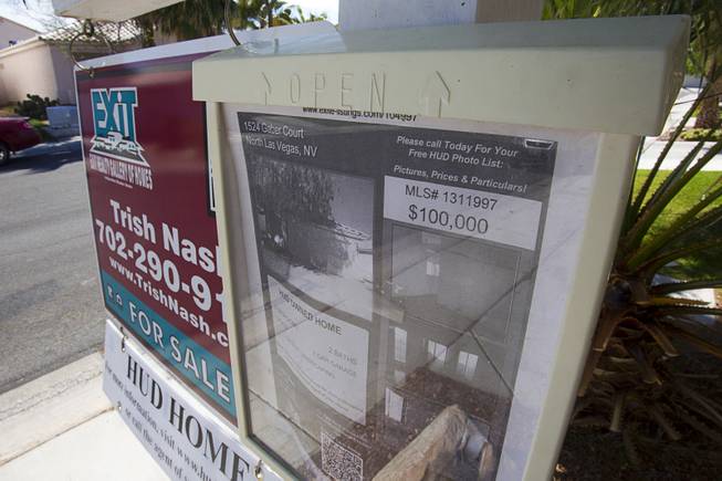 A sign is posted outside a vacant HUD home in North Las Vegas April 2, 2013. A neighbor said that it has been vacant for a bout two years. (1524 Gaber Court, North Las Vegas)