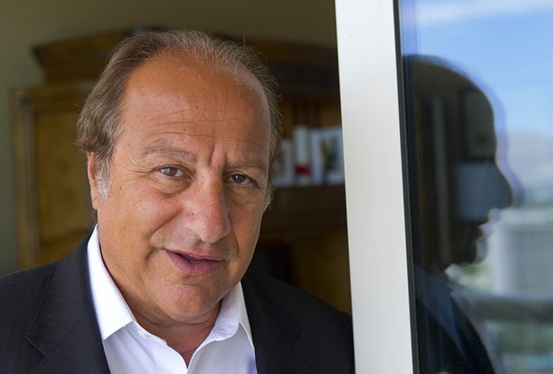Entrepreneur Byron Georgiou poses at his office in Las Vegas, April 3, 2013. Georgiou and others are working on a plan to help Las Vegas residents with underwater mortgages.