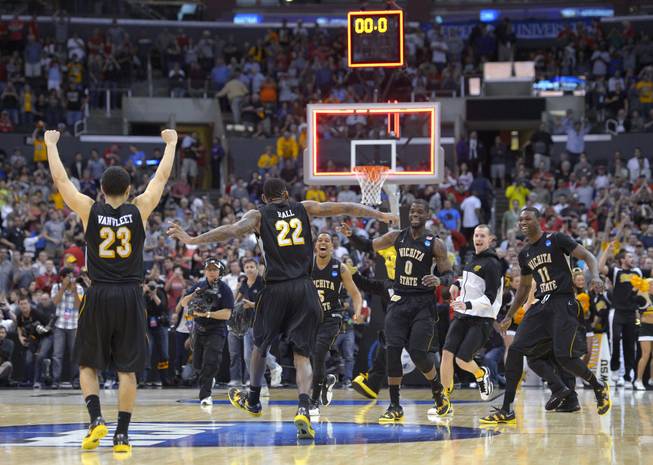 Wichita State players celebrate their 70-66 win over Ohio State in the West Regional final in the NCAA men's college basketball tournament, Saturday, March 30, 2013, in Los Angeles. 