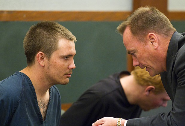 Gage James Lindsey, 18, listens to attorney Sean Sullivan at the Regional Justice Center Thursday, April 4, 2013. Lindsey is facing charges related to the Monday accident at the Egg & I restaurant that injured 10 people.