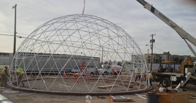 Workers put together the geodesic dome that will top the Downtown Project's Container Park at Seventh and Fremont streets.