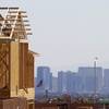 A carpenter works on a new home at a residential construction site in the west side of the valley April 5, 2013. Las Vegas is a lower-wage metro area that can attract people not by its economic prowess but by its supply of lower-cost housing.