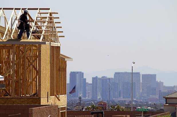 A carpenter works on a new home at a residential construction site in the west side of the valley April 5, 2013. Las Vegas is a lower-wage metro area that can attract people not by its economic prowess but by its supply of lower-cost housing.