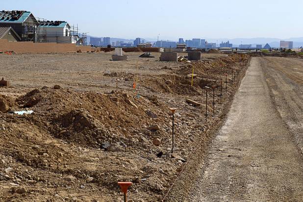 A residential construction site is shown in the west side of the Las Vegas Valley in Las Vegas, April 5, 2013.  Las Vegas Strip casinos are shown in the background.