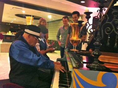 Joe Vento performs at Royal House Resort with “Jersey Boys” cast members Deven May (seated), Rob Marnell and Jason Martinez.