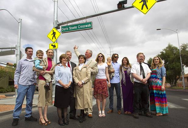 Family members of Doris Stoehr pose in front of a new crosswalk on North Decatur Boulevard Monday, April 8, 2013. The crosswalk is dedicated to Stoehr, a resident of the nearby Las Vegas Manor senior complex, who was killed crossing the boulevard in February.