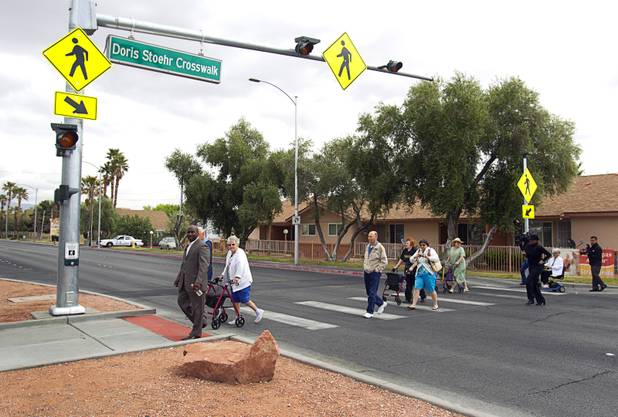 Las Vegas City Councilman Ricki Y. Barlow leads a group of seniors from the Las Vegas Manor during a crosswalk dedication on North Decatur Boulevard Monday, April 8, 2013. The crosswalk is dedicated to Doris Stoehr, a resident of senior complex, who was killed crossing the boulevard in February.
