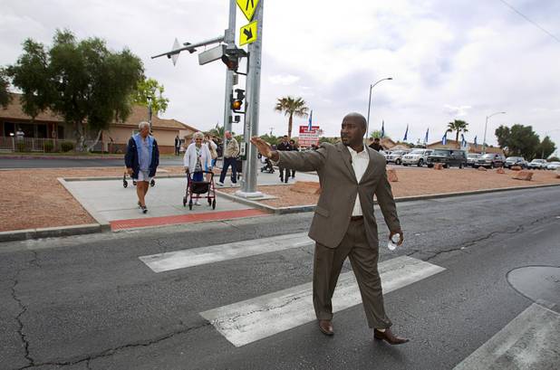 Las Vegas City Councilman Ricki Y. Barlow leads a group of seniors from the Las Vegas Manor during a crosswalk dedication on North Decatur Boulevard Monday, April 8, 2013. The crosswalk is dedicated to Doris Stoehr, a resident of senior complex, who was killed crossing the boulevard in February.