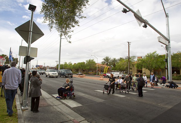 Las Vegas Manor residents try out a new crosswalk on North Decatur Boulevard Monday, April 8, 2013. The crosswalk is dedicated to Doris Stoehr, a resident of complex, who was killed crossing the boulevard in February.