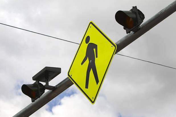 Warning signs and lights as shown on a new crosswalk on North Decatur Boulevard Monday, April 8, 2013. The crosswalk is dedicated to Doris Stoehr, a resident of Las Vegas Manor senior complex, who was killed crossing the boulevard in February.