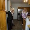 Fafie Moore, left, a Realty Executives owner/broker, and realtor Helen Riley look over a home being offered for sale in Henderson April 8, 2013.