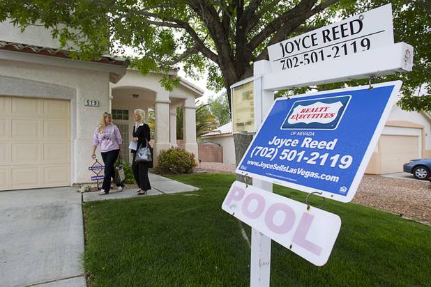 Realtor Helen Riley and Fafie Moore, a Realty Executives owner/broker, leave a home being offered for sale in Henderson on Monday, April 8, 2013.