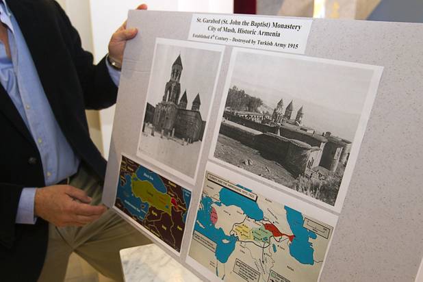 Andy Armenian holds a display of photos of the original St. Garabed Monastery at St. Garabed Armenian Apostolic Church of Las Vegas on East Desert Inn Road Tuesday, April 9, 2013. The church is nearing completion and is scheduled to be consecrated this weekend by Western Prelate Archbishop Moushegh Mardirossian.