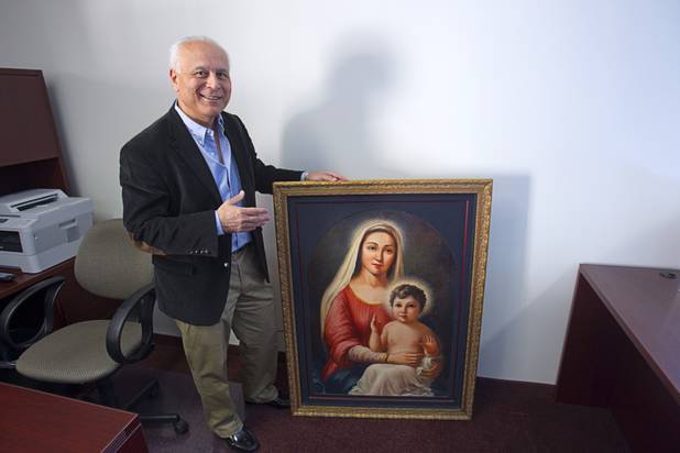 Andy Armenian shows a Madonna and Child painting at St. Garabed Armenian Apostolic Church of Las Vegas on East Desert Inn Road Tuesday, April 9, 2013. The painting has followed the congregation from several previous temporary sites, he said.