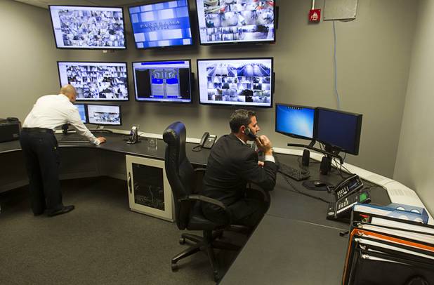 Christian Petrou, left, CEO and founder of Rvnue Technologies, and Security Director River Polson work in the Security Operations Center before a hi-tech security tour of the Panorama Towers Wednesday, April 10, 2013. Petrou designed the security system at the condo towers. The tour was held in conjunction with the International Security Conference & Exposition (ISC West)  taking place at the Sands Expo Center.