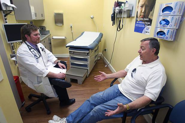 Physician Assistant Brian Ekberg listens to Gerry Eirkl of Henderson at a Southwest Medical Associates clinic inside a Walmart, 300 E. Lake Mead Pkwy., in Henderson Thursday, April 11, 2013.