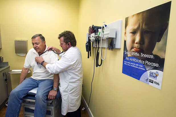 Gerry Eirkl of Henderson is examined by Physician Assistant Brian Ekberg at a Southwest Medical Associates clinic inside a Walmart, 300 E. Lake Mead Pkwy., in Henderson Thursday, April 11, 2013.