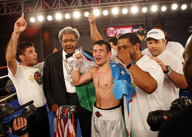 Bahodir "Baha" Mamadjonov of Uzbekistan celebrates with boxing promoter Don King and members of his camp after beating Angelo "La Cobra" Santana of Cuba in a WBA lightweight bout at the Treasure Island Friday, April 12, 2013. Mamadjonov won the fight with a ninth-round TKO.