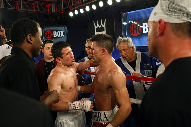 Bahodir "Baha" Mamadjonov, left, of Uzbekistan speaks with Angelo "La Cobra" Santana of Cuba after a WBA lightweight bout at the Treasure Island Friday, April 12, 2013. Mamadjonov won the fight with a ninth-round TKO.
