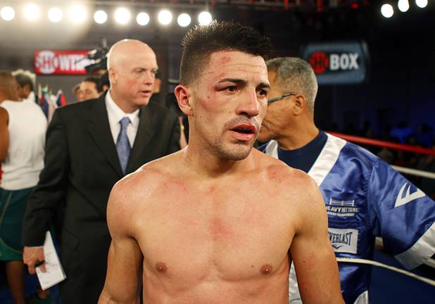 Angelo "La Cobra" Santana of Cuba walks through the ring after losing to Bahodir "Baha" Mamadjonov of Uzbekistan during a WBA lightweight bout at the Treasure Island Friday, April 12, 2013. Mamadjonov won the fight with a ninth-round TKO.
